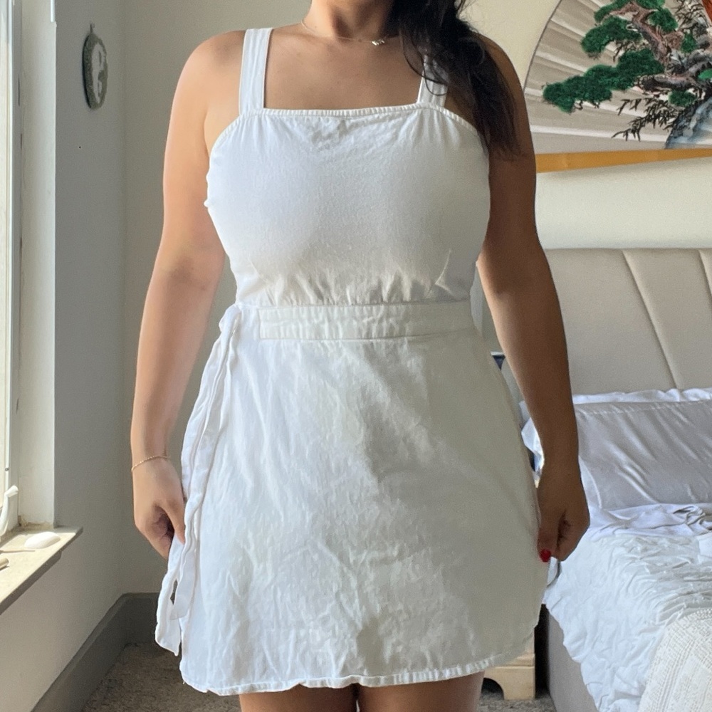 White sleeveless 100% cotton “hidden-shorts” romper